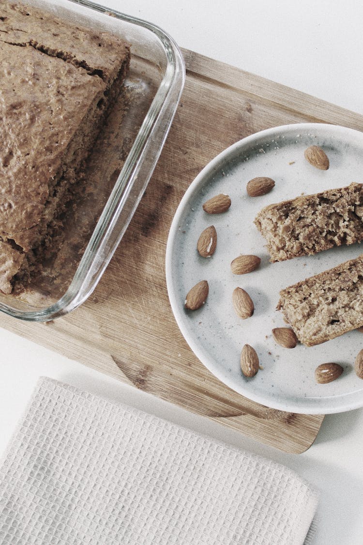 Overhead Shot Of A Plate With Banana Bread And Almonds