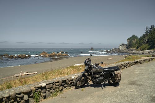 Black Motorcycle Parked on Concrete Road