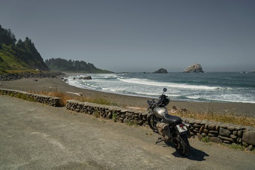 Black Motorcycle Parked on Concrete Road