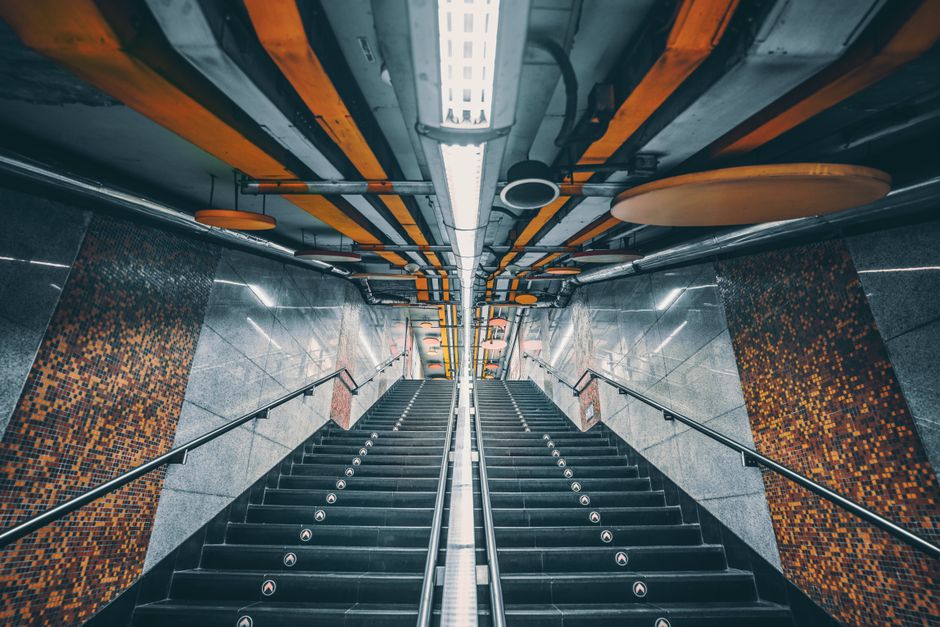Clean and modern interior of a Shanghai Metro station with passengers waiting