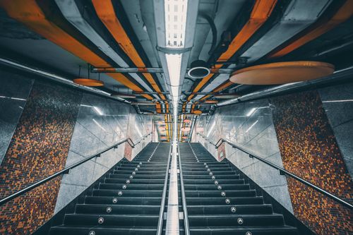 Free Dynamic perspective of a modern subway stairway with striking ceiling design in Beijing, China. Stock Photo