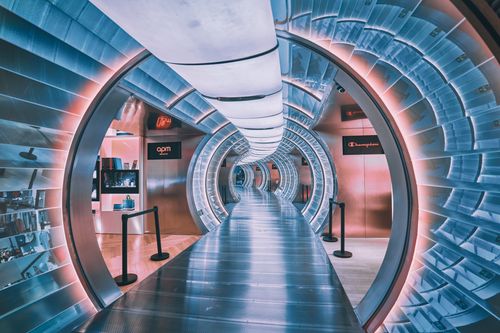 Free A vibrant, illuminated tunnel with neon colors and modern design inside a mall in Beijing. Stock Photo