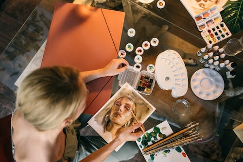 High Angle Shot of a Woman Painting