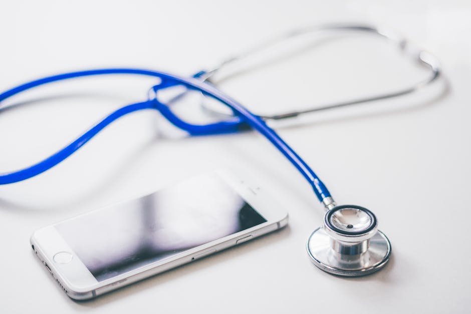 Silver Iphone 6 Near Blue and Silver Stethoscope