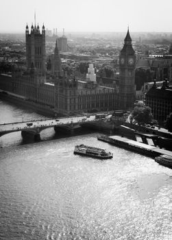 Aerial grayscale view of Westminster Bridge, Big Ben, and the River Thames in London.