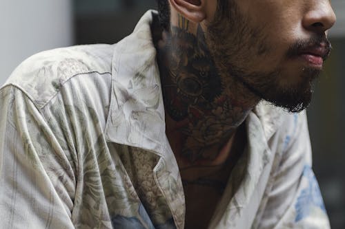 Free Bearded man with tattoos on neck Stock Photo