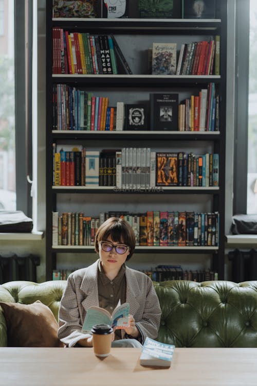 Woman in Gray Sweater Sitting on Couch