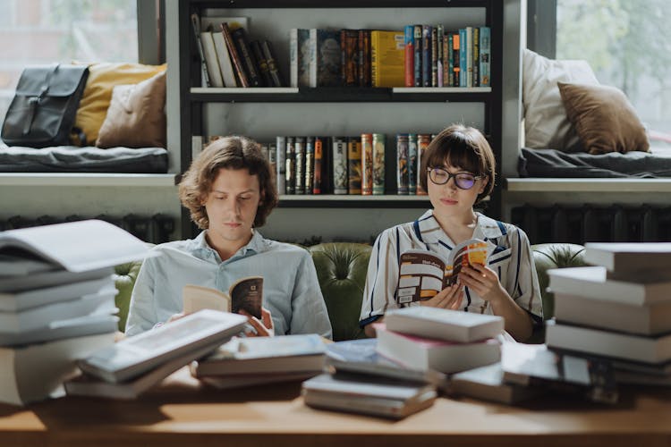 Man And Woman Reading A Book