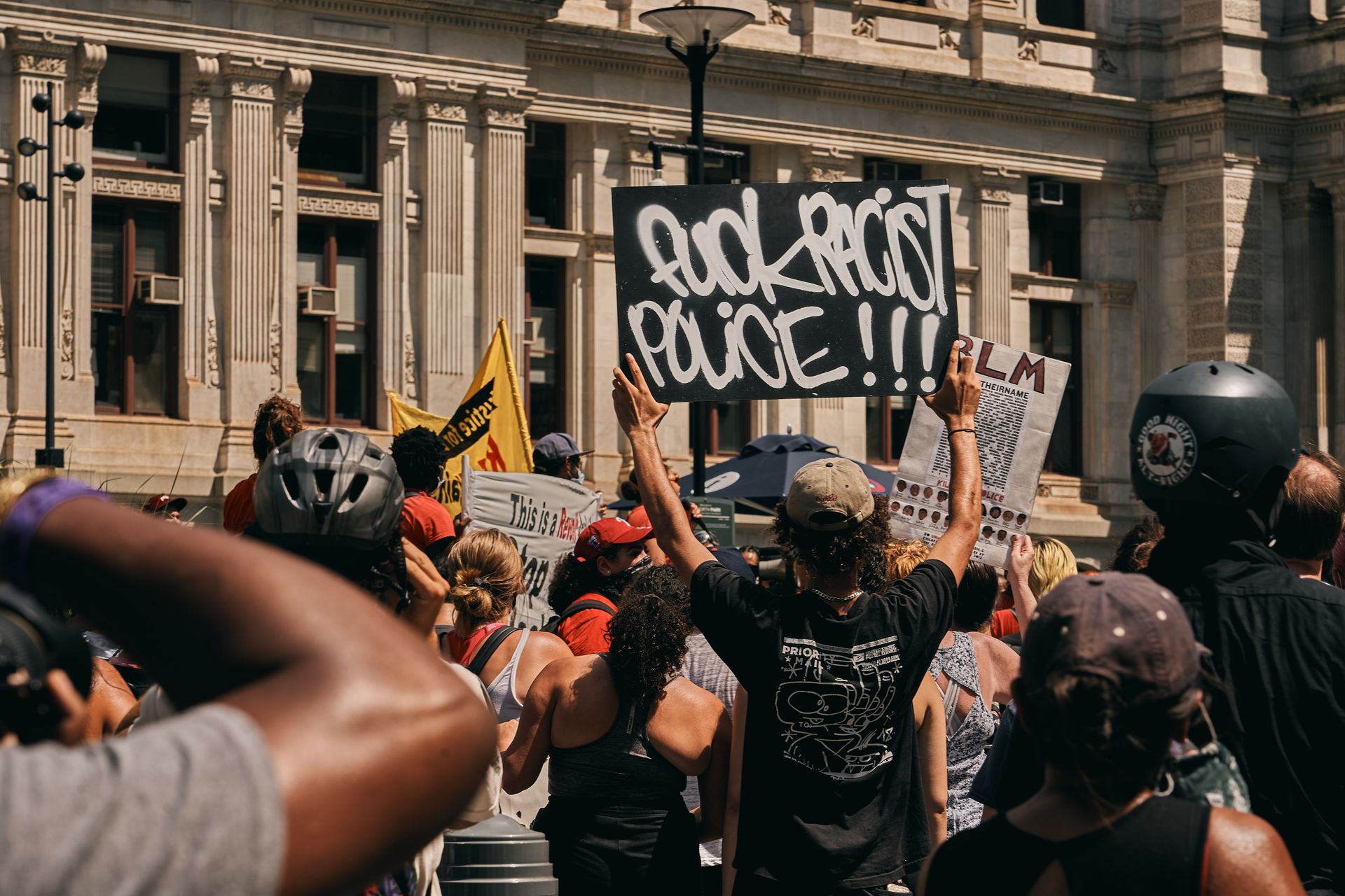 Protesters rally in Philadelphia advocating against police racism and supporting BLM.