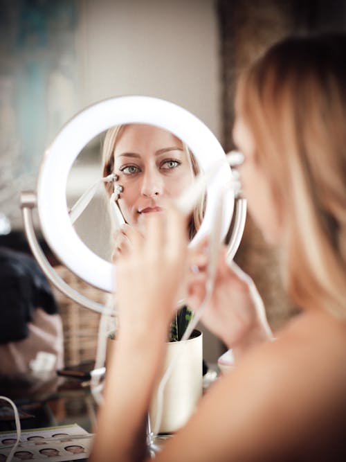Free Woman Looking at Mirror Stock Photo