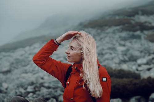 Woman in Red Jacket Hiking in Nature