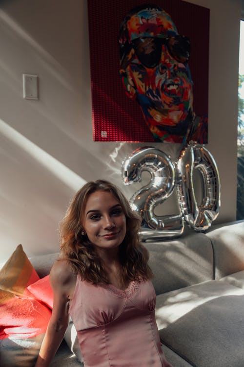 Skinny charming woman on couch in bright room