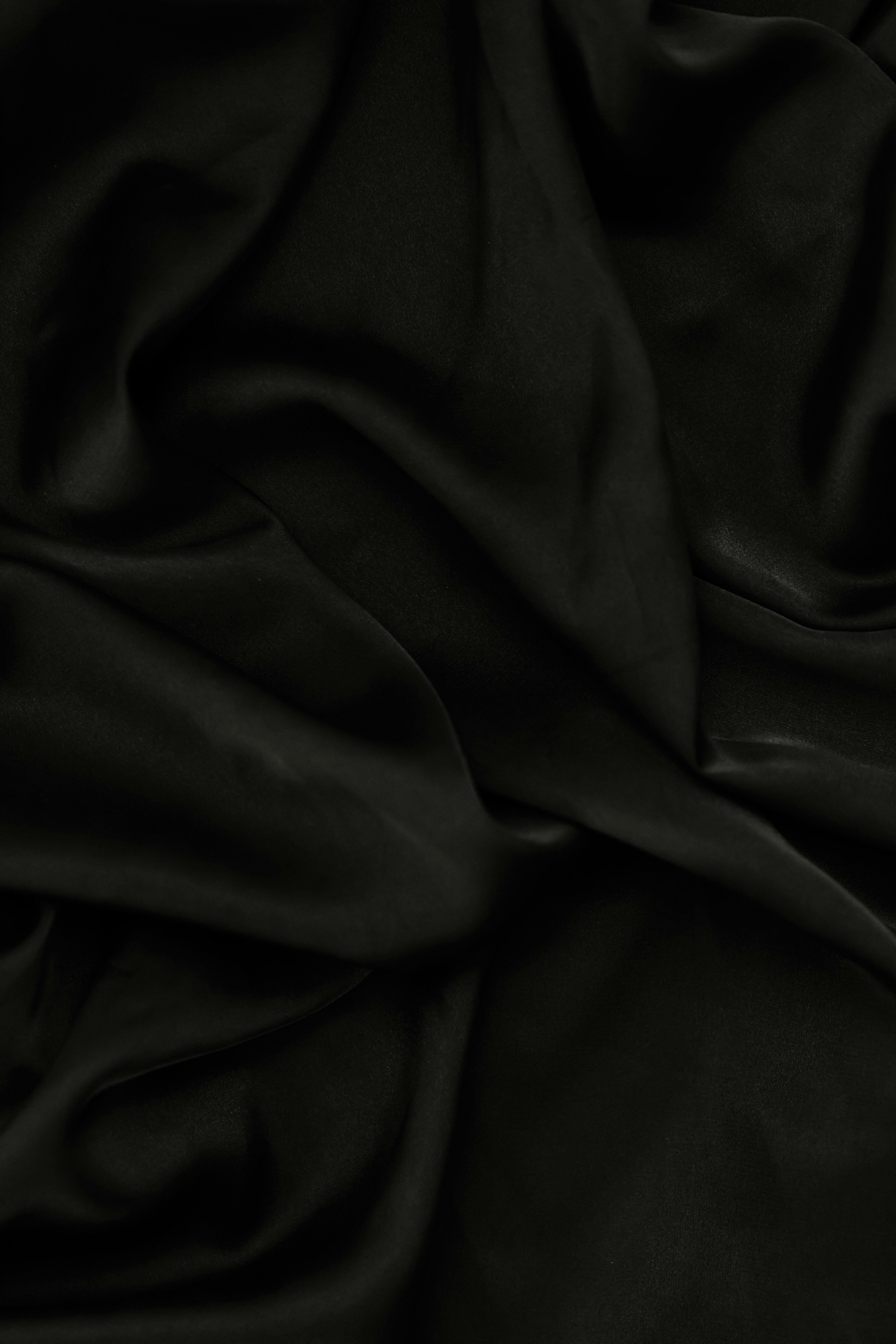 A Close-Up Shot of a Black Curtain · Free Stock Photo, image size:3985x5977