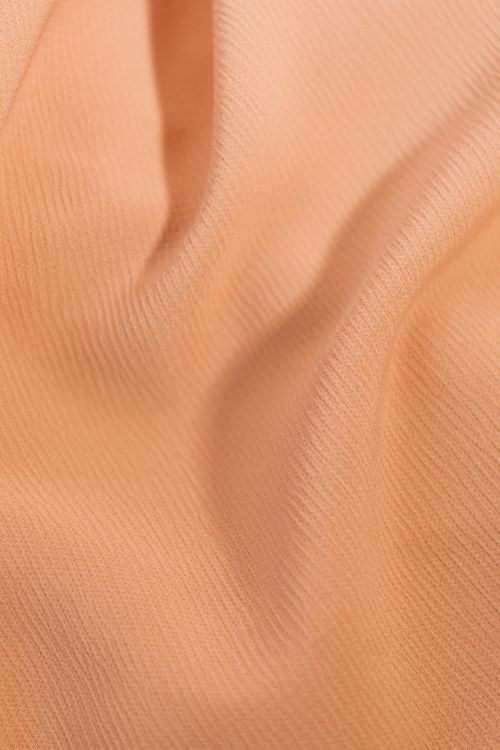Free Close-up of a soft pastel fabric with rippled texture, perfect for background use. Stock Photo