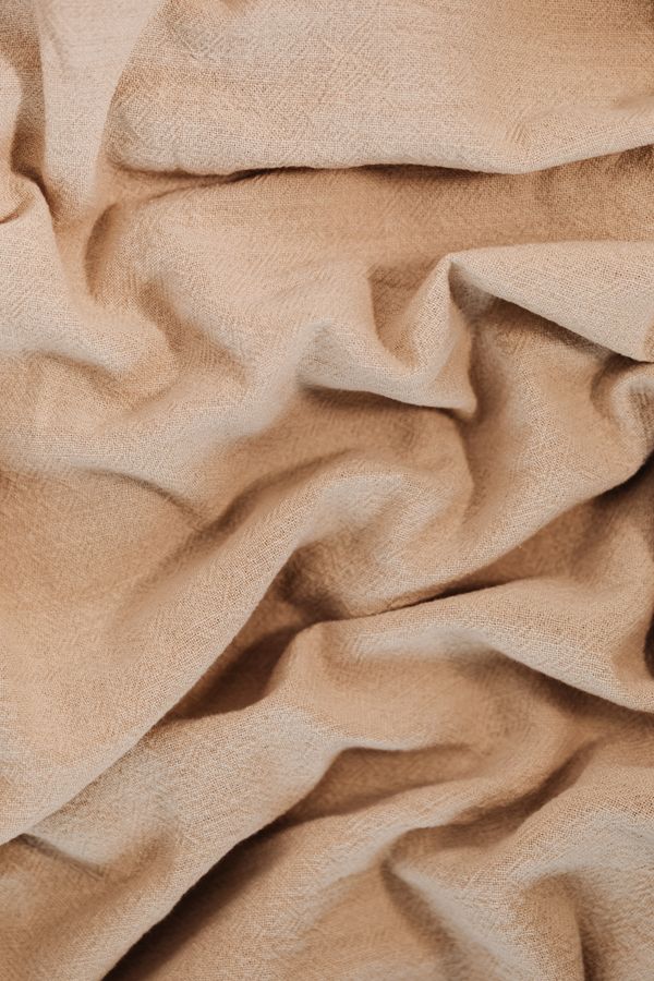 Folded beige linen texture — Kaboompics on Pexels