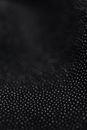 White Polka Dot Pattern on Black Fabric
