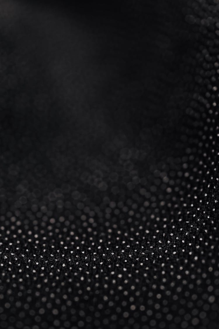 White Polka Dot Pattern On Black Fabric