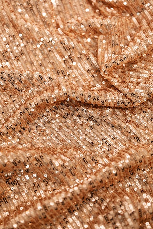 Close-up Photo of a Brown Sequence Textile