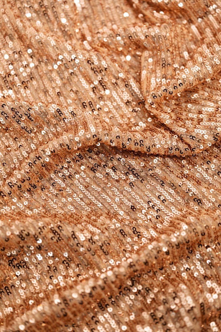 Close-up Photo Of A Brown Sequence Textile