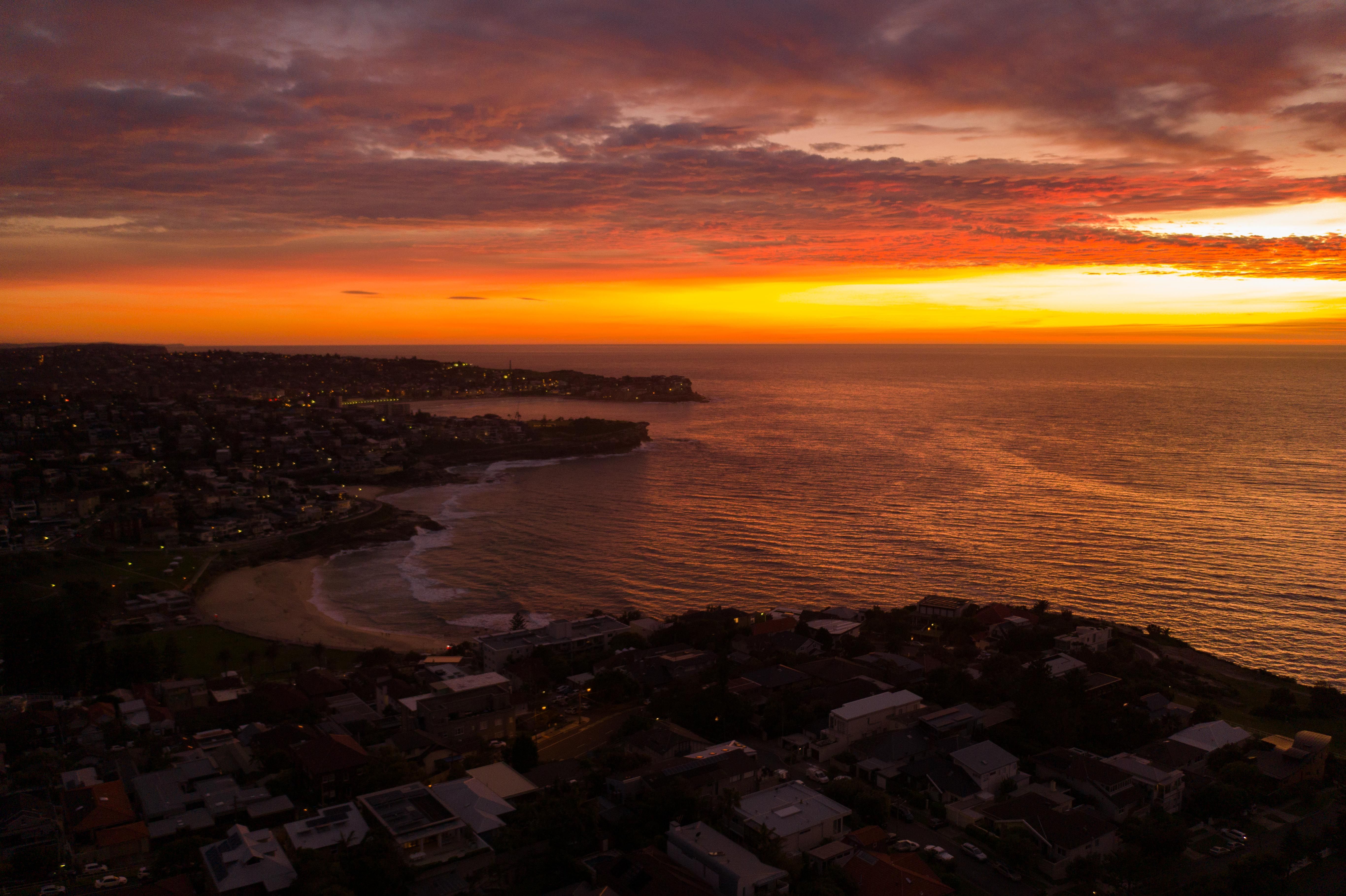Aerial View of the Coastal City During Sunset · Free Stock Photo