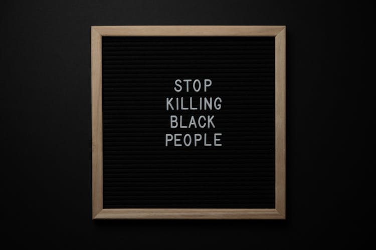 Blackboard With Stop Killing Black People Inscription