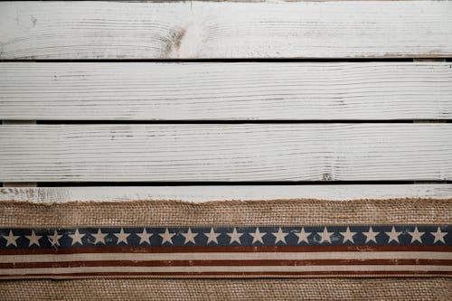 Overhead view of ornamental USA ribbon with stars and stripes symbolizing justice and democracy