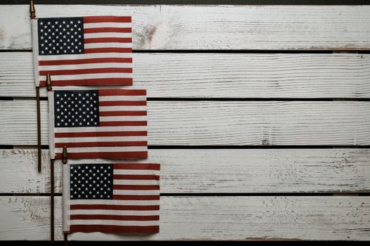 American flags on wooden surface on Independence Day