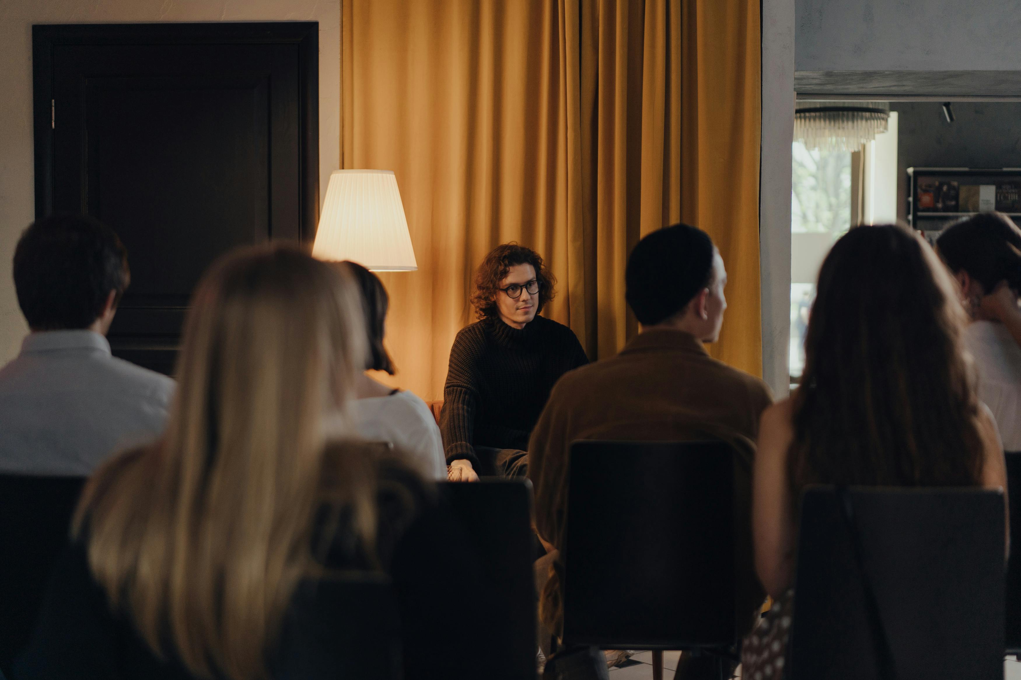 people sitting on chairs inside room