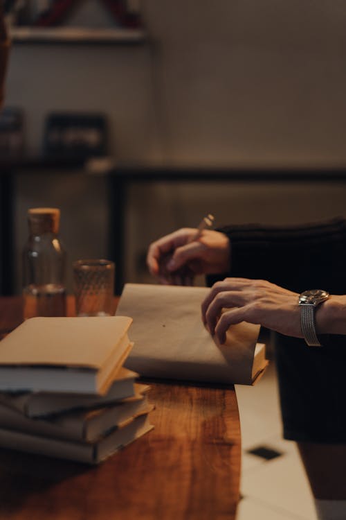 Close-Up Photo of Person Opening a Book