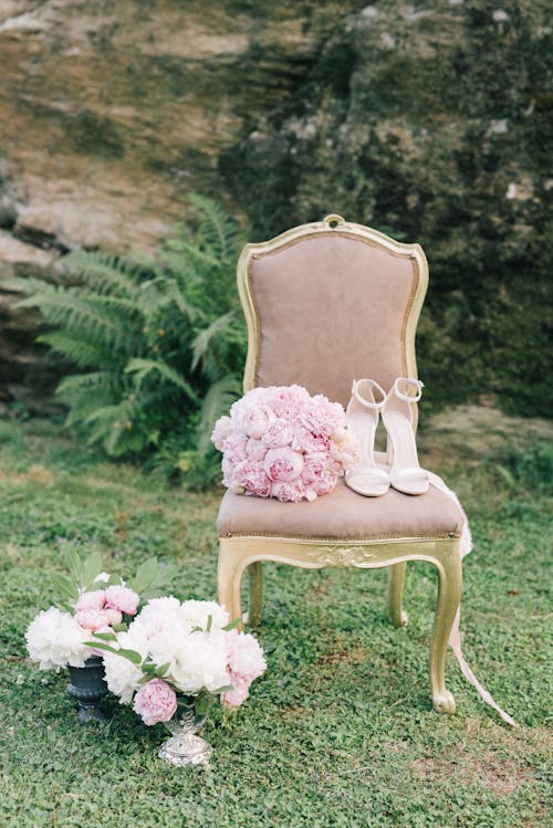 Bouquet of Flowers and High Heels on a Chair