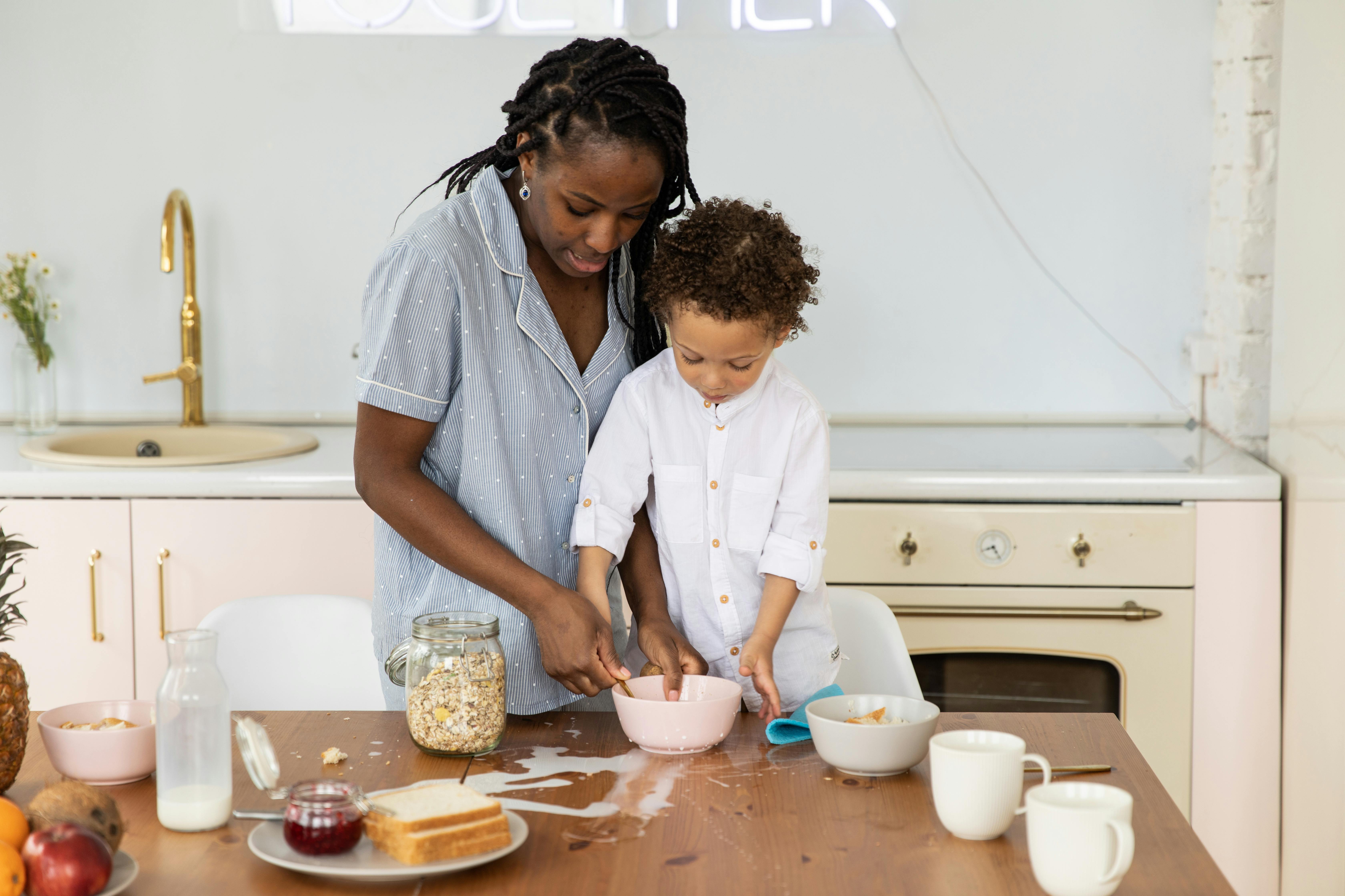 mother with child on table in kitchen