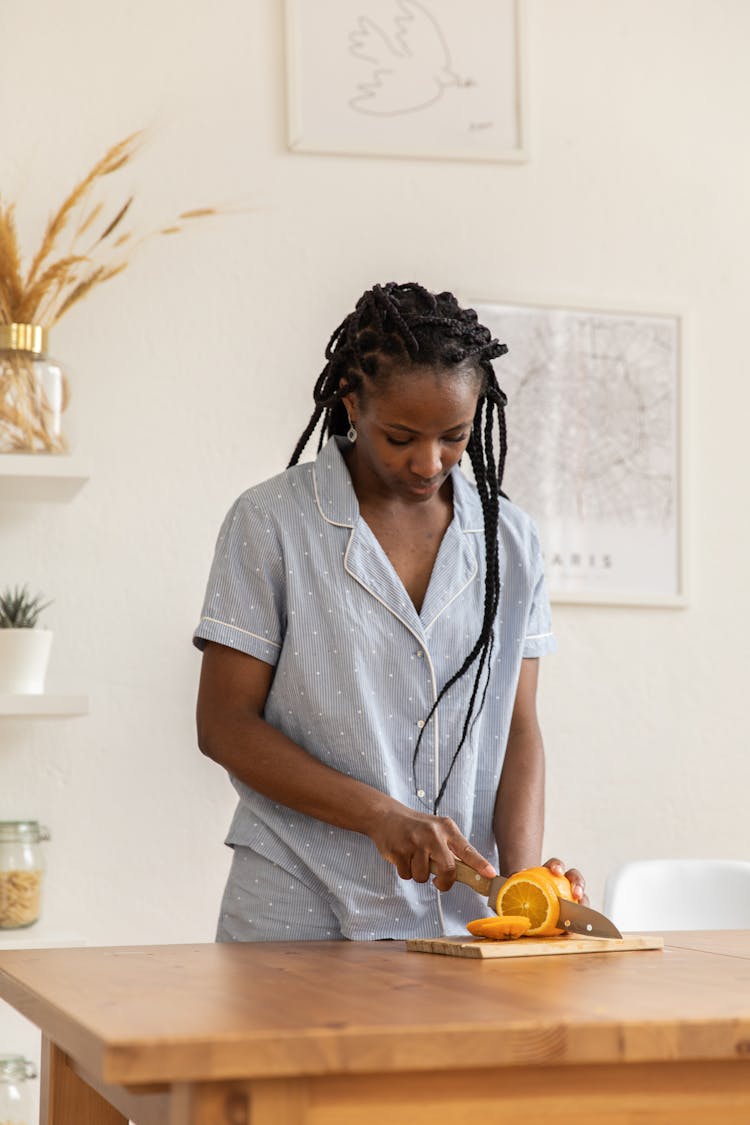 Woman Slicing Orange