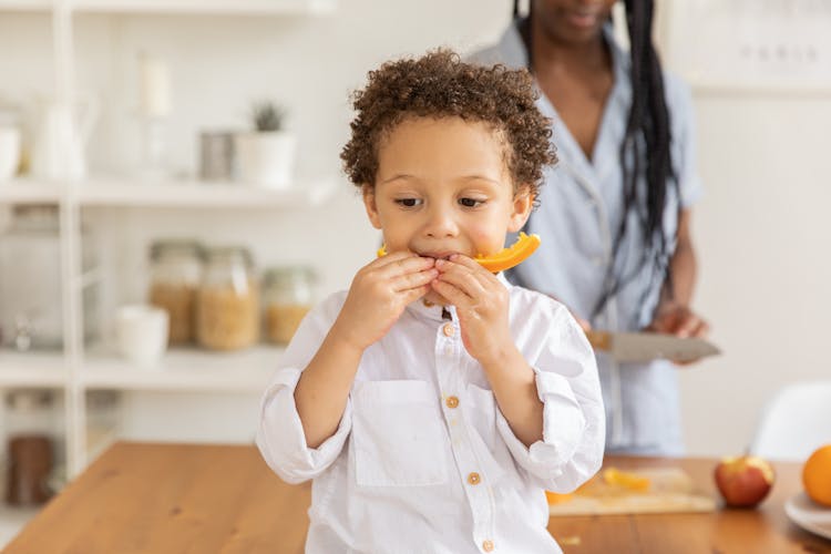 Boy Eating Fruit