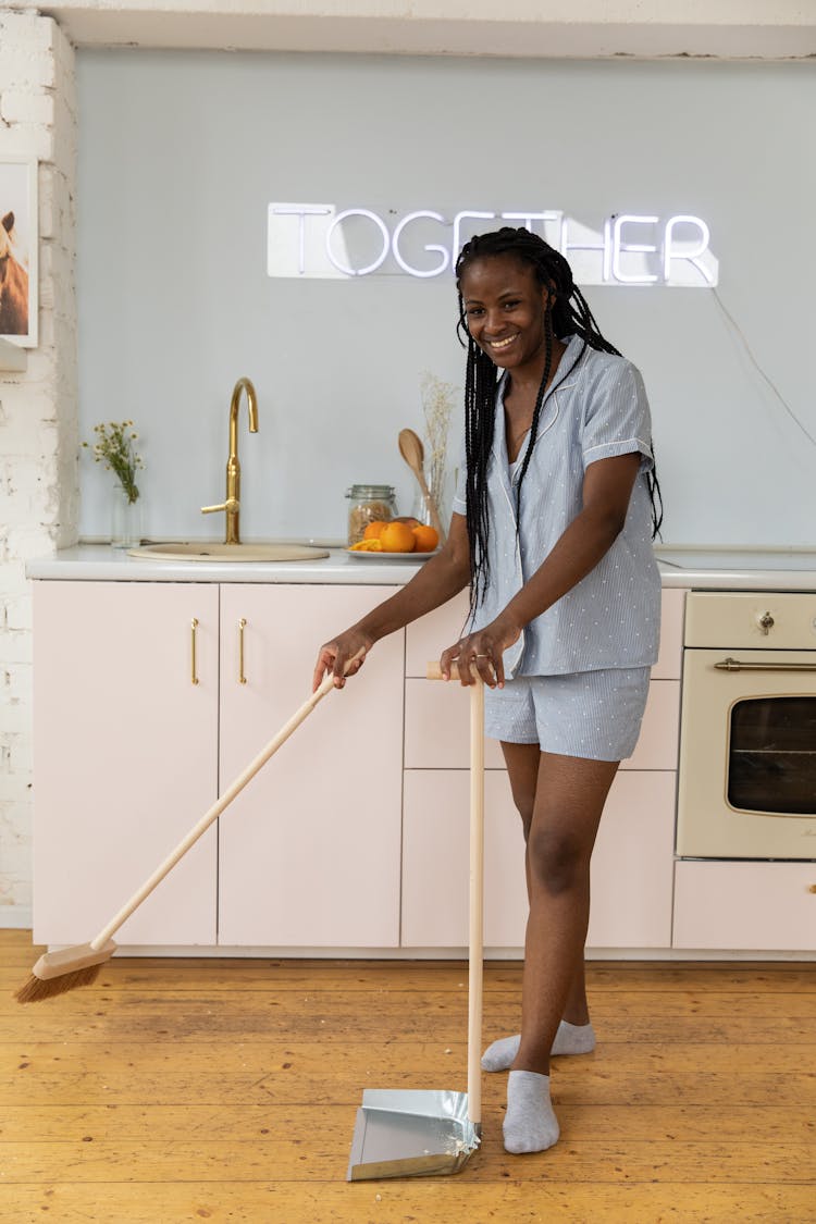 Woman Cleaning In Kitchen