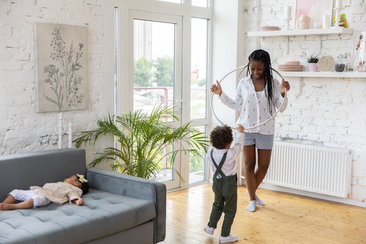 Mother With Children In Room