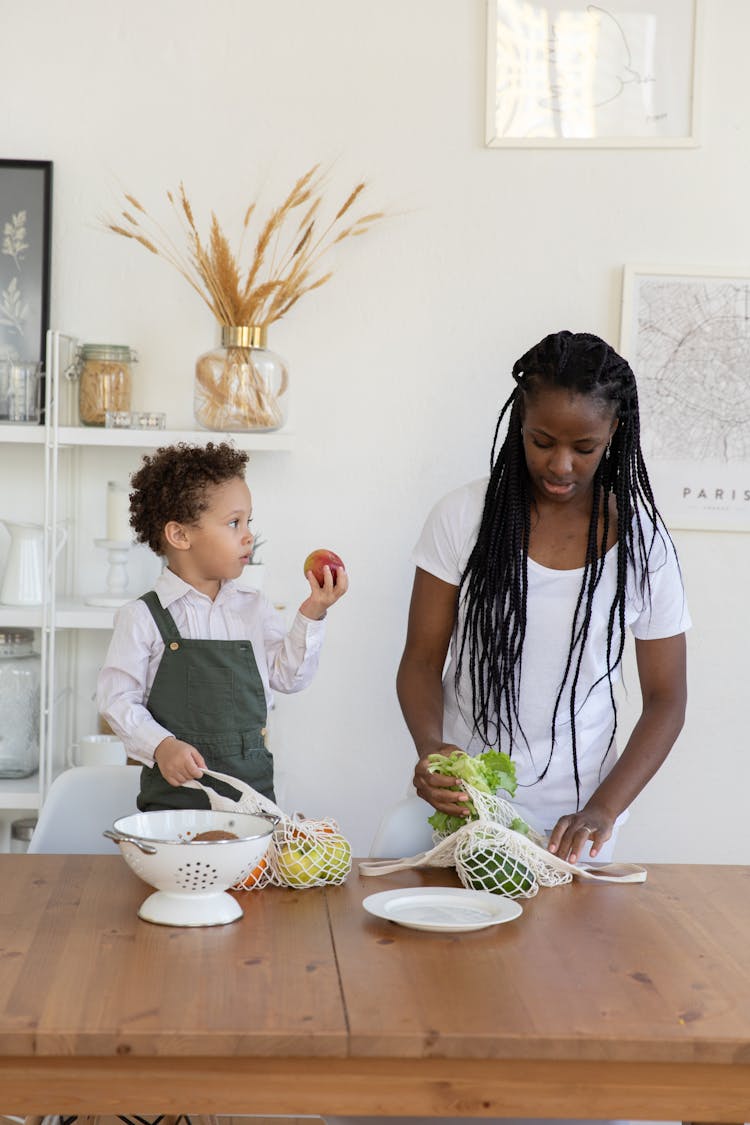 Mother And Child Holding Apple