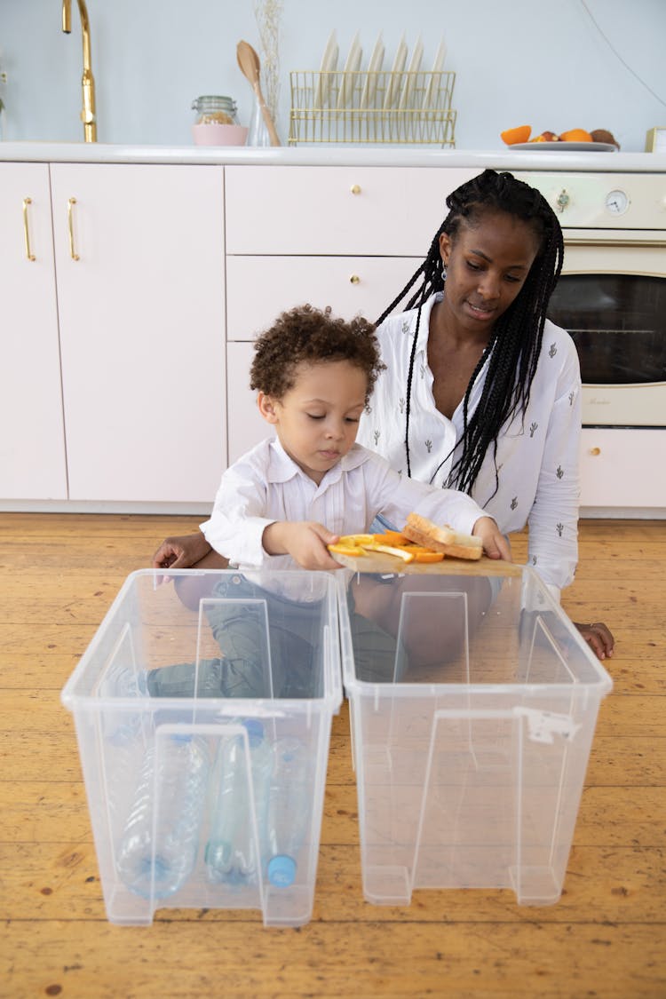 Mother And Child Throwing Trash