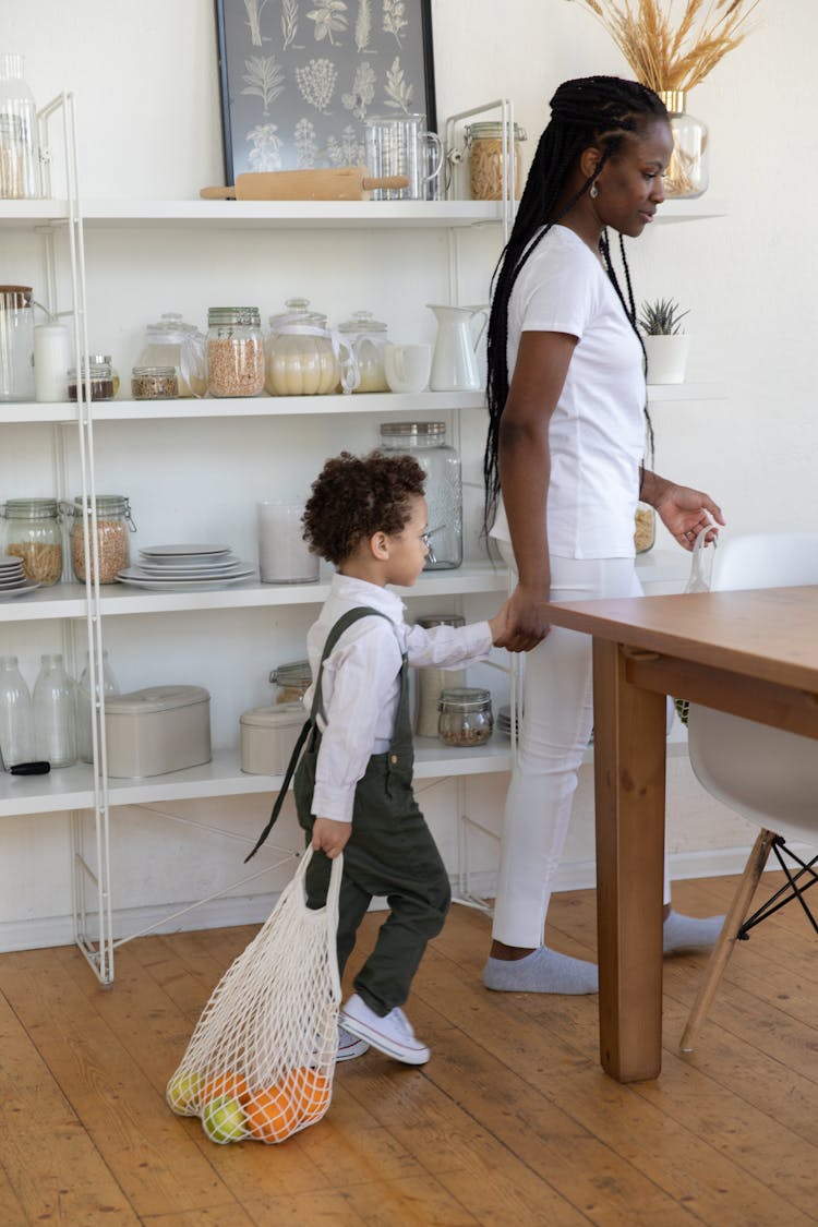 Mother And Child With Bag