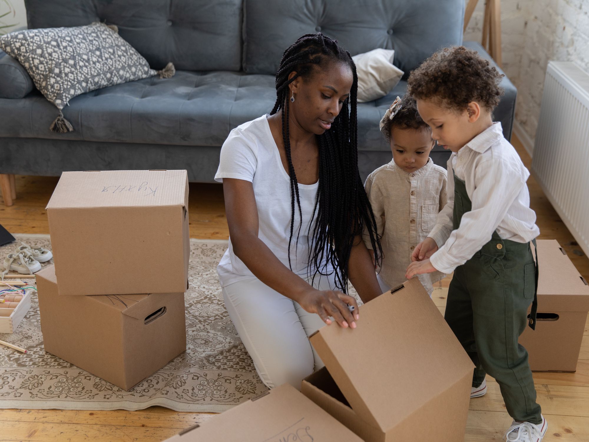 Flat Removals in Bisley, South West — movers carrying boxes for a flat move