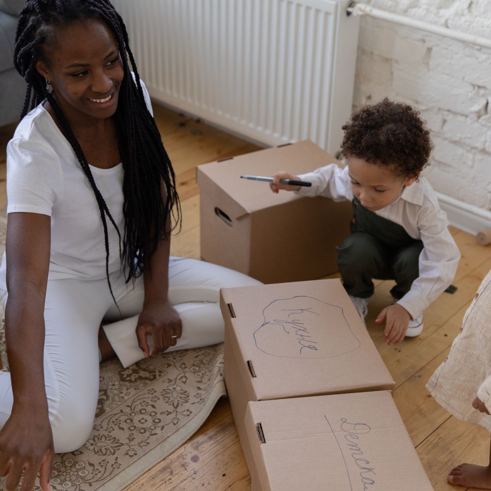 Upwell — movers carrying boxes for a flat move
