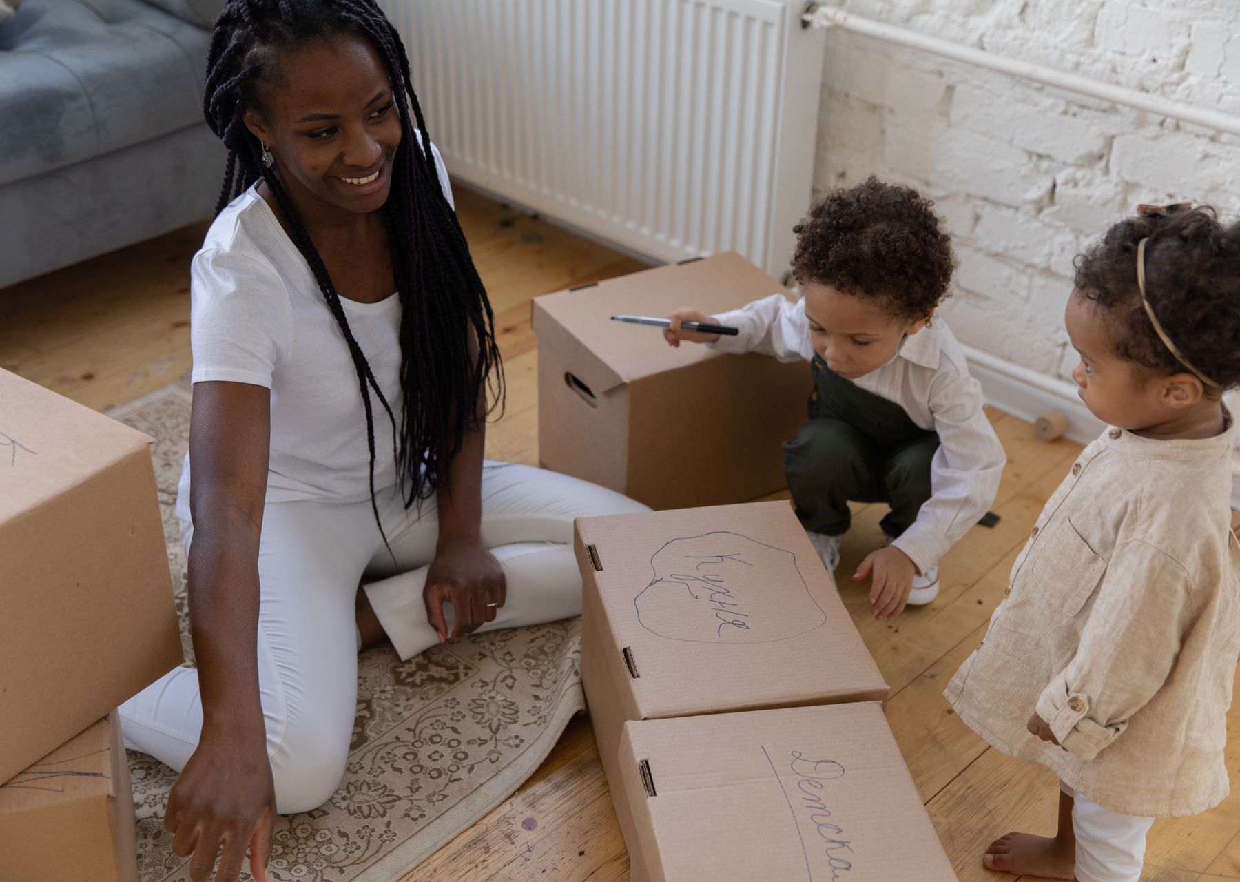 Packing services in New Mill — crew wrapping and loading on moving day