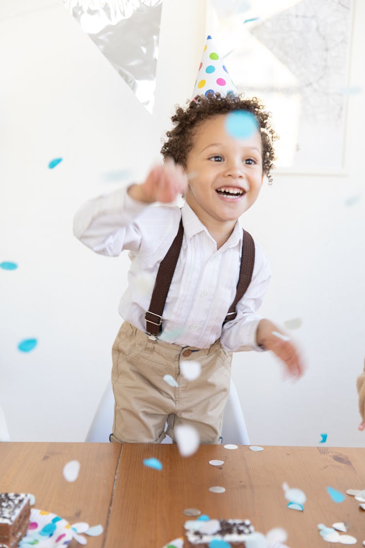 Boy Wearing A Birthday Hat