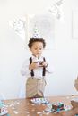 Little Boy Holding Slice of Birthday Cake