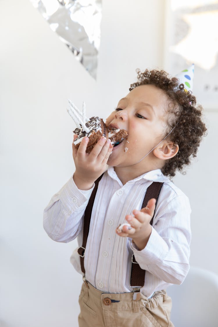 Little Boy Eating Cake 