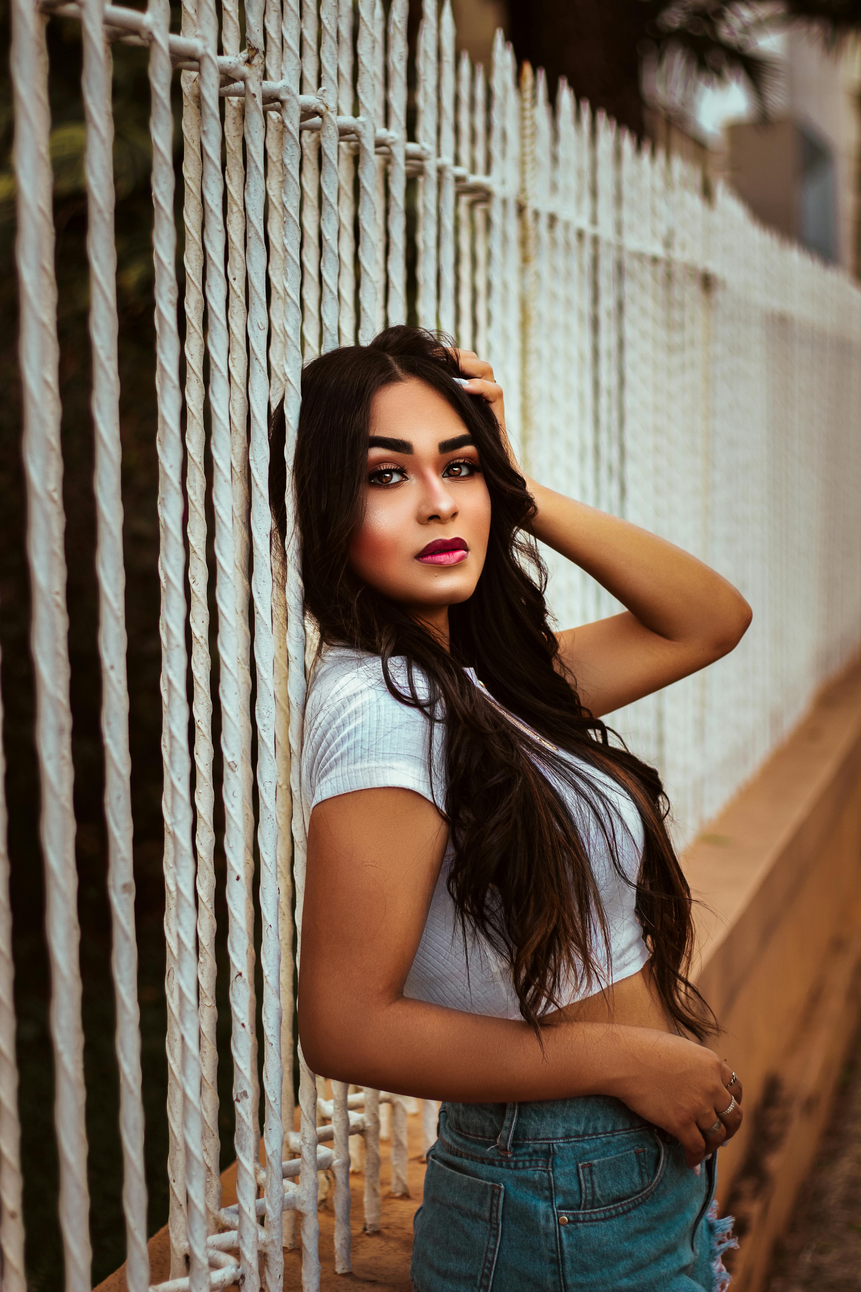 Stylish model with red lips and piercings outdoors · Free Stock Photo