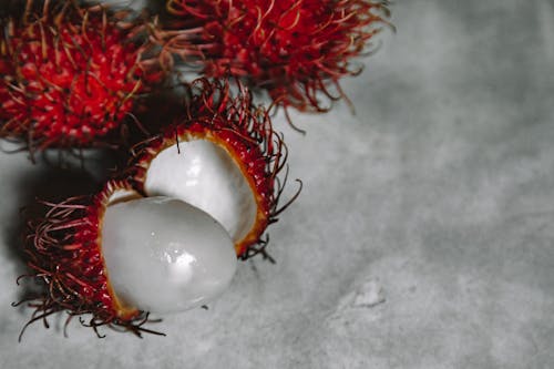 Rambutan Fruits on Gray Surface