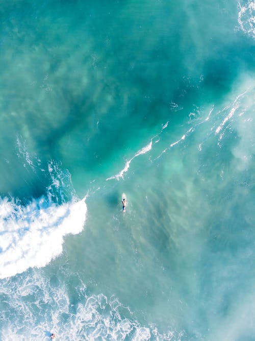 Person Surfing on Sea Waves