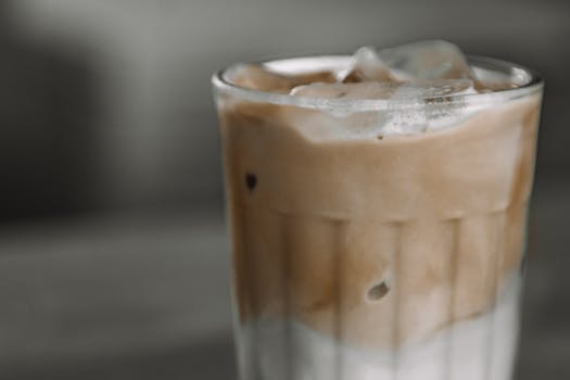 Close-up of a refreshing iced coffee in a glass, perfect for a summer day.