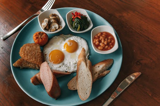 A vibrant breakfast plate featuring eggs, bread, hash browns, and a variety of sides.