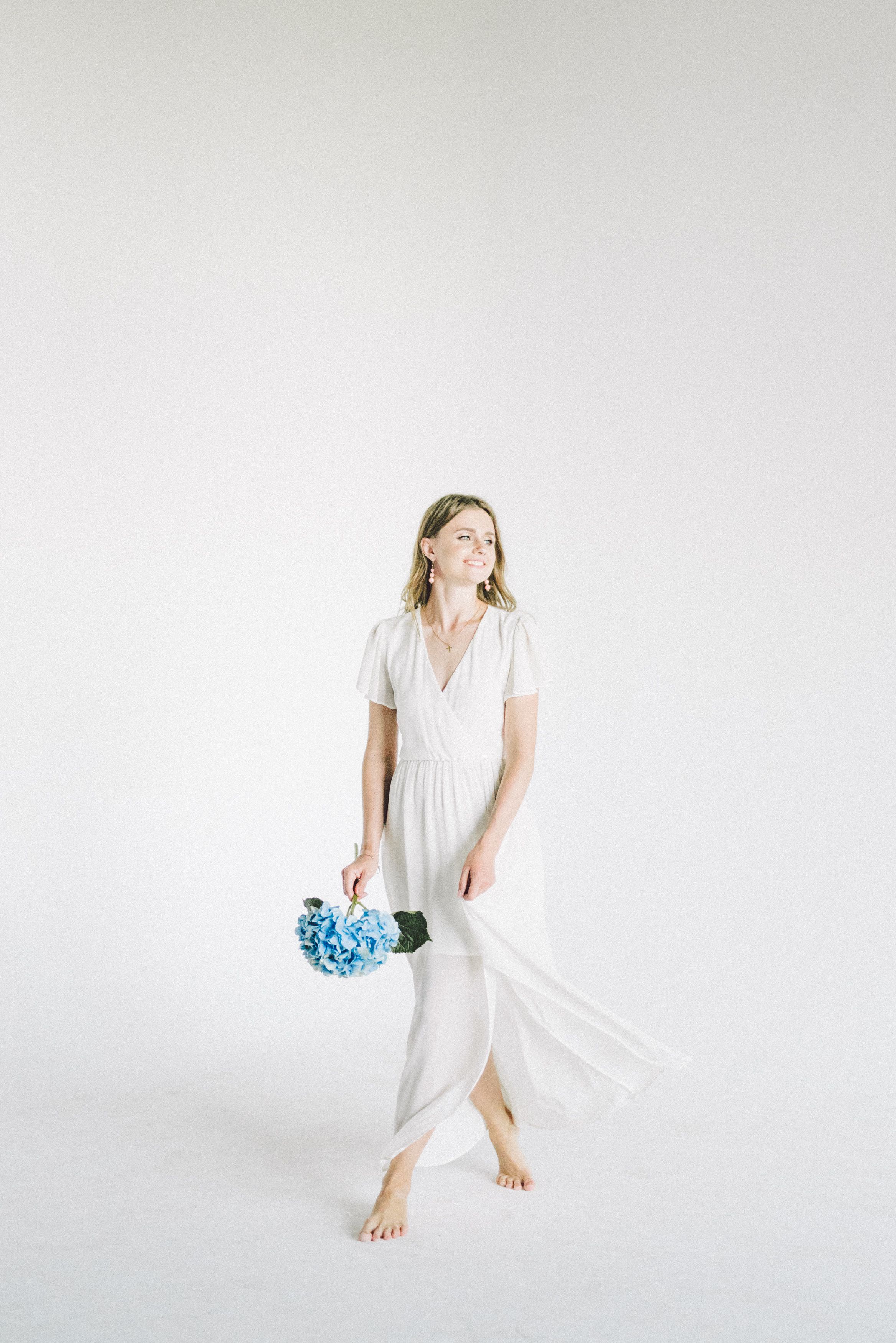 Woman In White Dress Holding Bouquet Of Flowers · Free Stock Photo